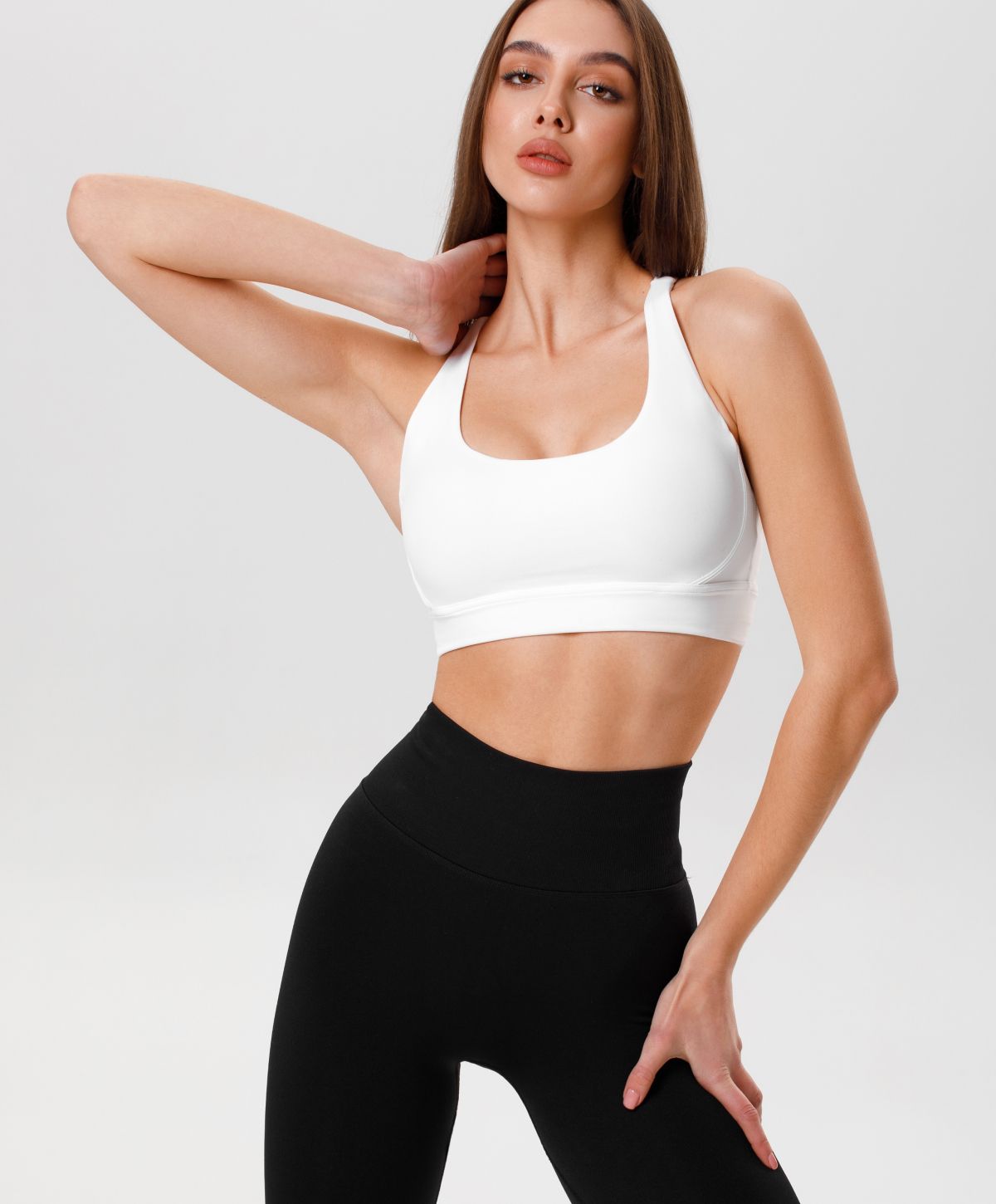 Model posing elegantly in a stylish outfit.