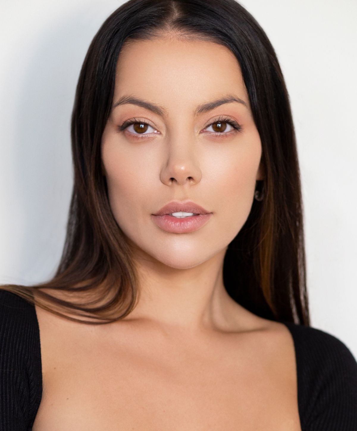 Close-up portrait of a woman with long hair.
