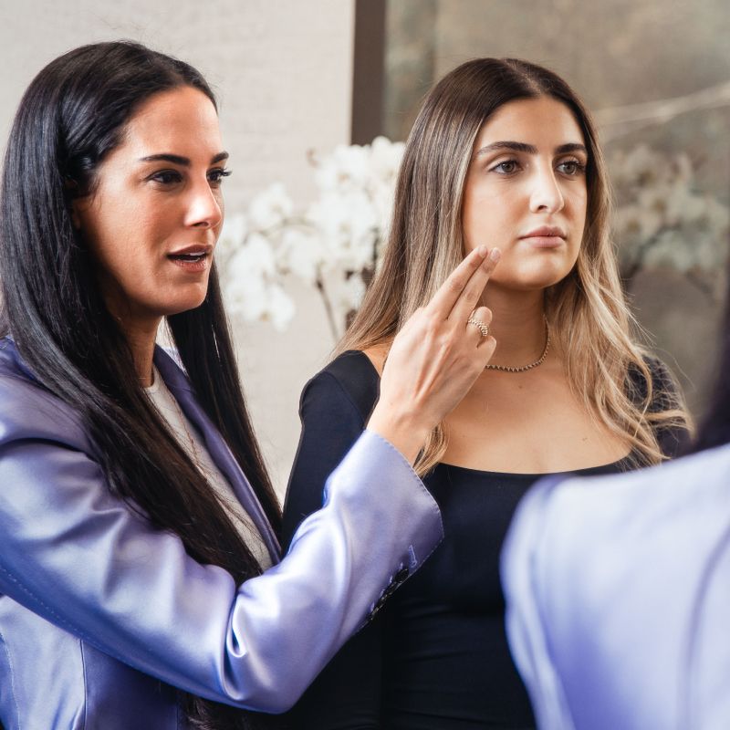 Two women engaged in conversation.