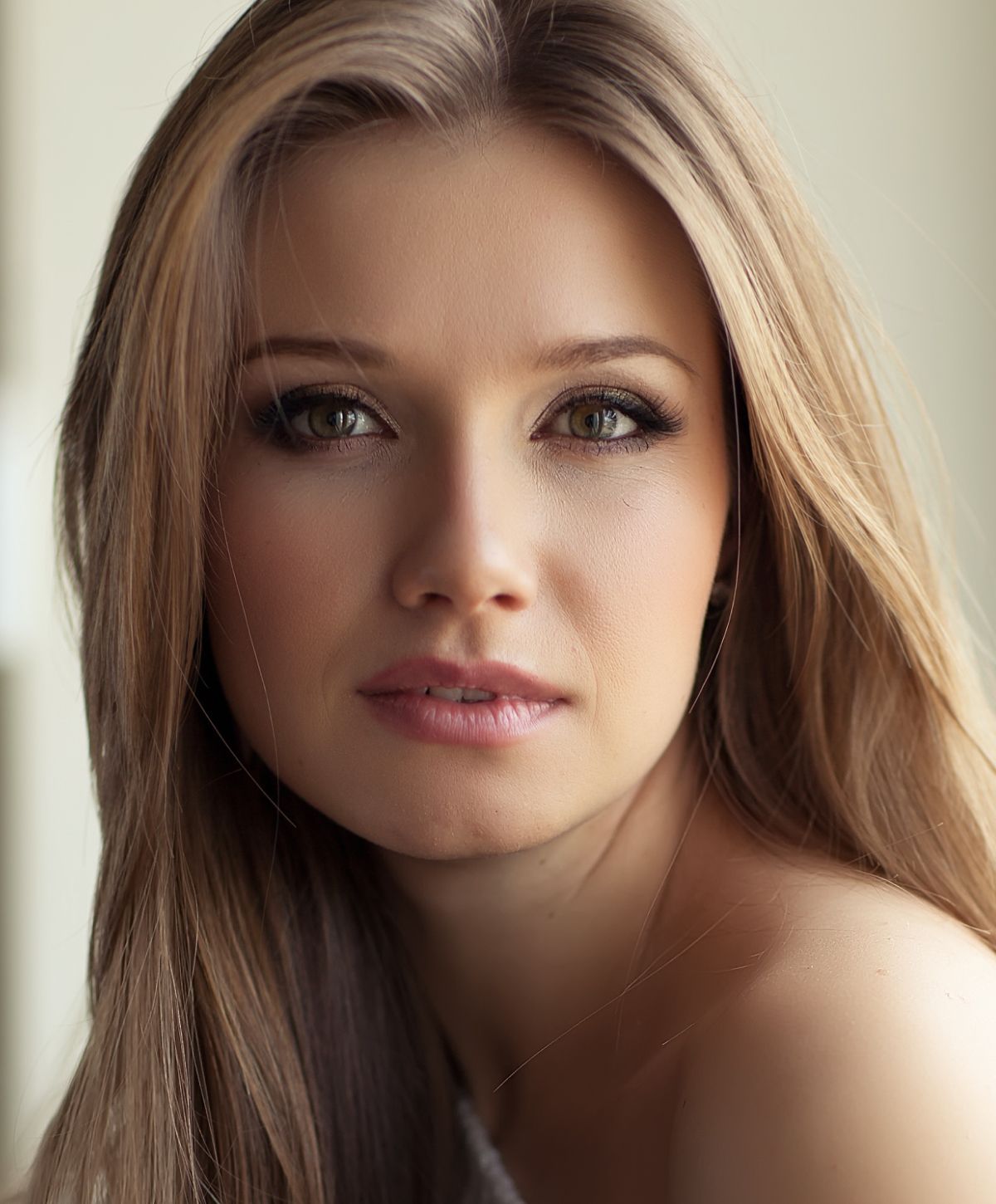 Portrait of a woman with long, flowing hair.