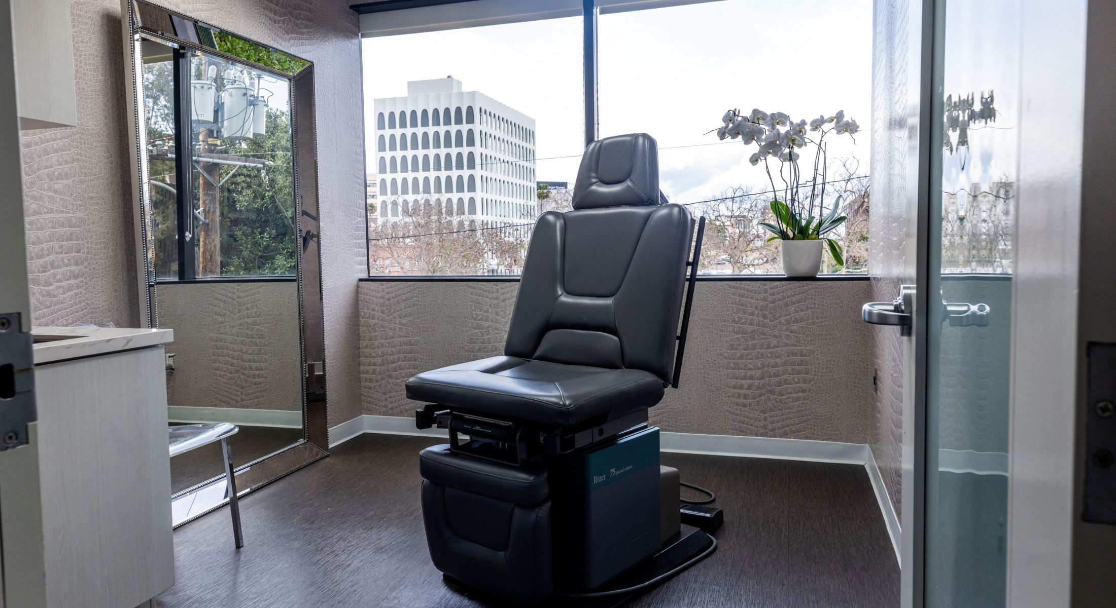 Medical examination room with adjustable chair.