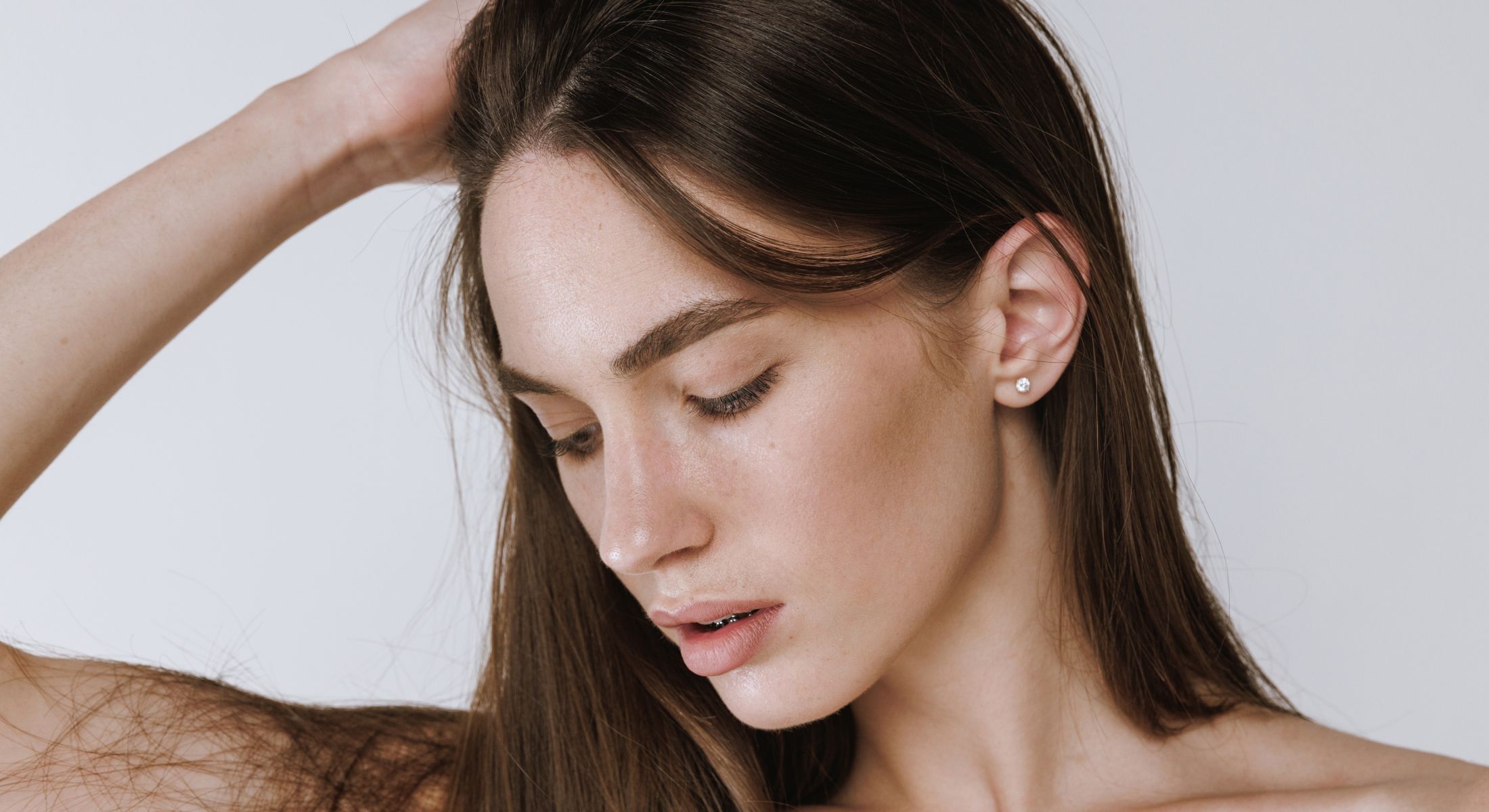 Close-up of a woman's thoughtful expression.