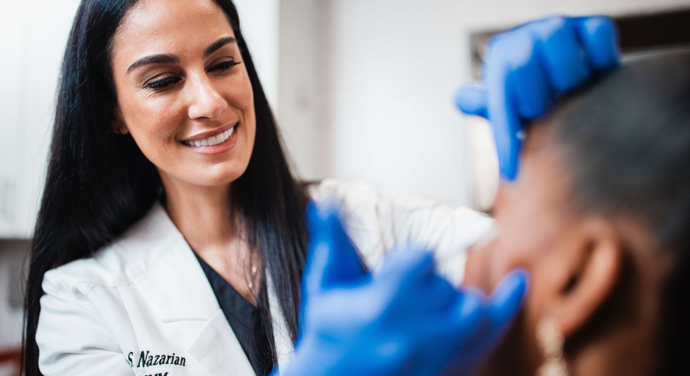 Medical professional consulting with a patient.