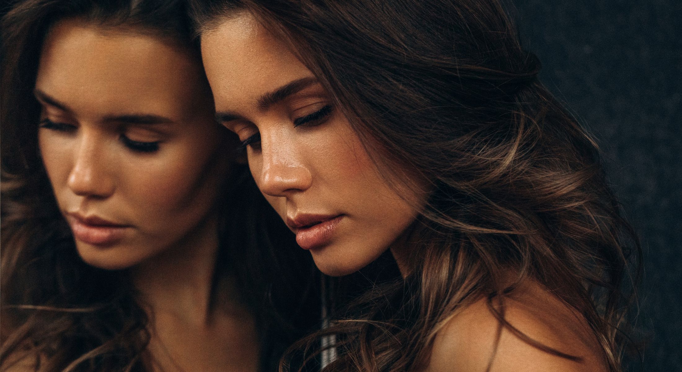 Close-up of a woman with flowing hair.