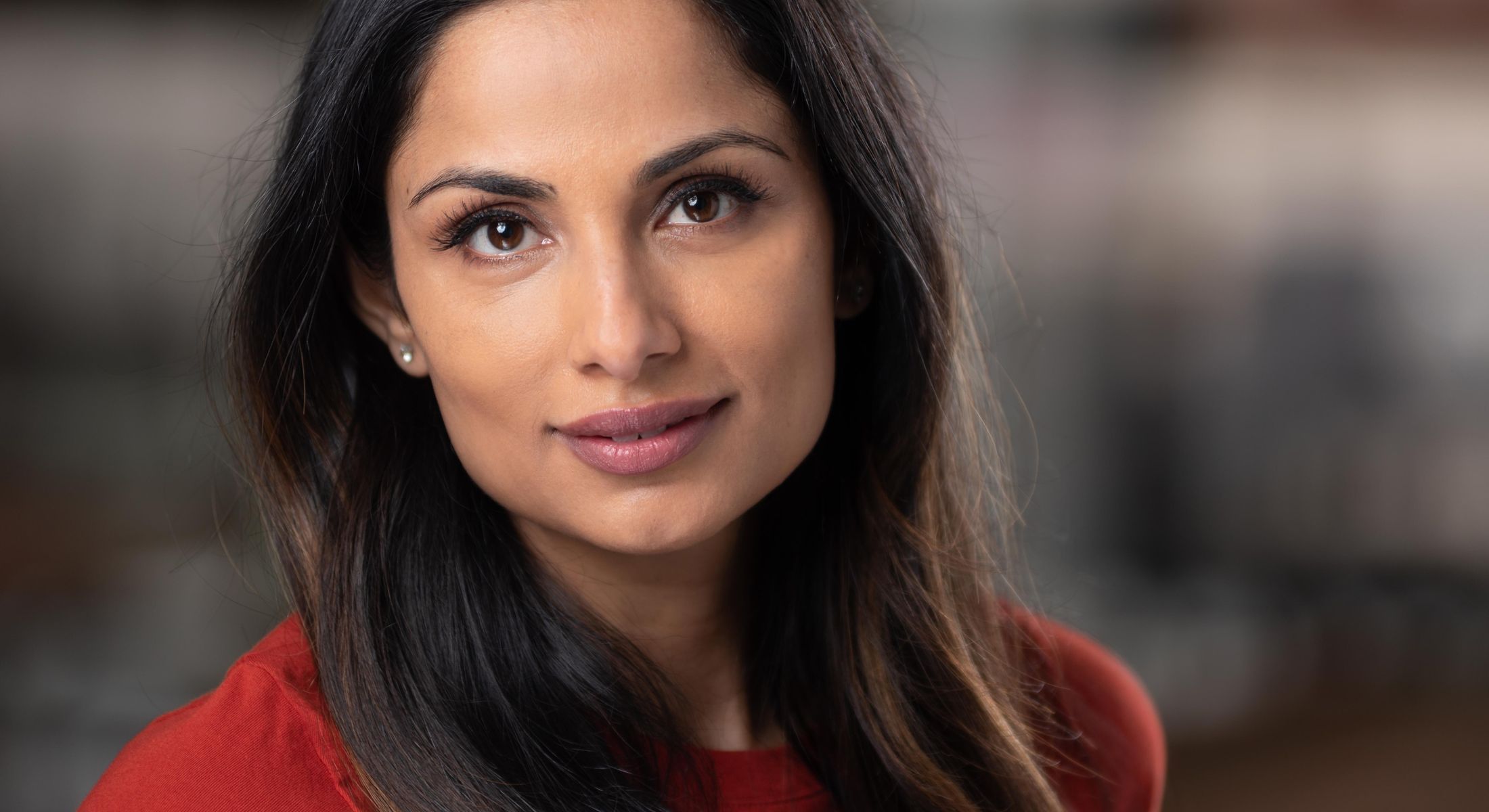 Portrait of a woman with long dark hair.